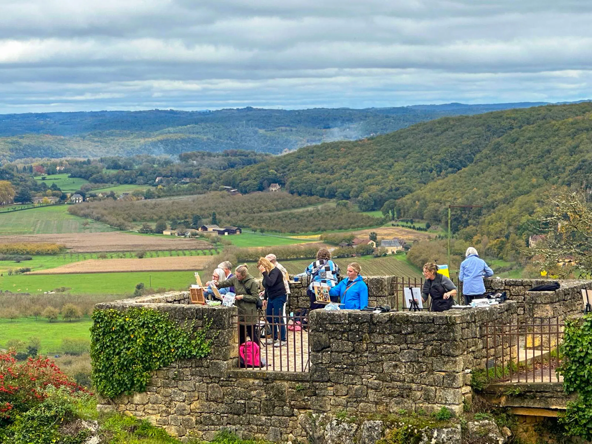 ardith Goodwin's group drinking Cahors and Bergerac wine at lunch
